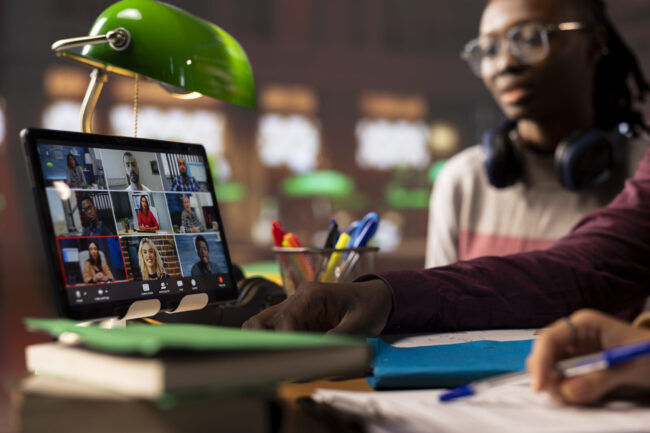 Group of diverse pupils engaging in an online course discussion via video call